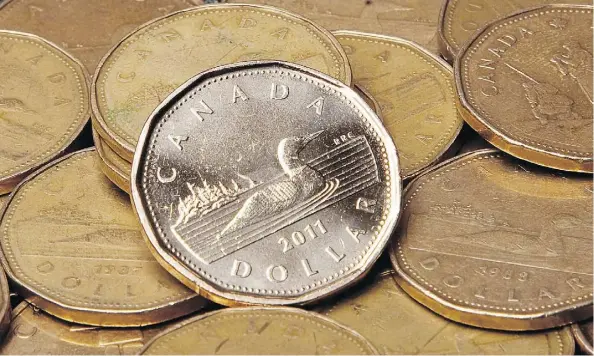  ?? JONATHAN HAYWARD/THE CANADIAN PRESS FILES ?? The loonie could get several boosts before year-end, says Scotiabank’s Shawn Osbourne. This includes the USMCA trade deal, which could be signed at the G20 Summit in Argentina this week and OPEC’s possible move to cut its output.