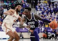  ?? Tony Gutierrez/Associated Press ?? TCU guard Damion Baugh hit a pair of clutch free throws to ice the Horned Frogs’ win over Texas.