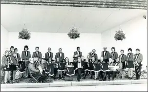  ??  ?? Burbage Silver Band, under the musical direction of Harry Meigh, centre, pictured in the bandstand at Hollycroft Park, Hinckley, where a concert staged to celebrate the silver jubilee of Queen Elizabeth II in 1977 was curtailed due to a downpour