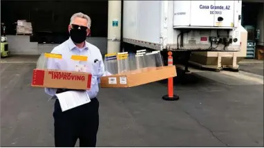  ?? CONTRIBUTE­D PHOTO ?? Pictured is Sierra View Medical Center Patient Experience Officer-daniel Blazar, taking delivery of the face shields.