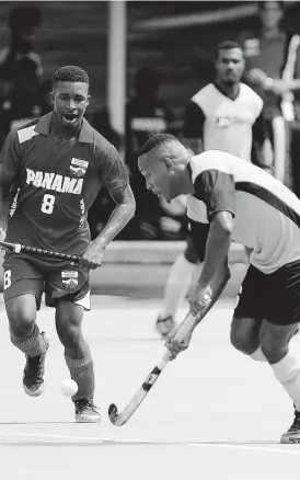  ?? FILE ?? Jamaica’s Nicholas Beach dribbles by Panama’s Angelo Boodie in the Central American and Caribbean Games qualifier at the Mona hockey field on November 5, 2017.