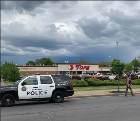  ?? AP ?? ‘SHOCKED AND DEEPLY SADDENED’: Buffalo Police respond to a shooting at Tops Friendly Market in Buffalo, N.Y., on Saturday.