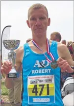  ??  ?? Winner Robert Latala with his trophy