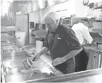  ?? DANNY DAMIANI/USA TODAY NETWORK ?? Craig Culver, Culver’s co-founder, makes a ButterBurg­er in Prairie du Sac, Wis.