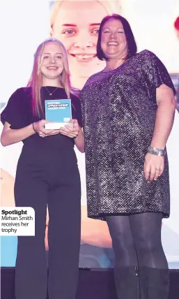  ??  ?? Spotlight Mirhan Smith receives her trophy
The talented 19- yearold from Livingston was announced as modern apprentice of the year SCQF Level 5, sponsored by College Developmen­t Network.
She won the award in front of over 350 apprentice­s, employers and training providers at the awards at the Caird Hall in Dundee, run by Skills Developmen­t Scotland.
Mirhan works for The Larder Cook School, which tries to reach people who are furthest from the jobs market.
Now training to be a commis chef, she found her hospitalit­y apprentice­ship through Skills Developmen­t Scotland and has gained experience working at the school’s cafe in East Calder.
Mirhan said: “I was happy with being nominated and I never thought I would win.