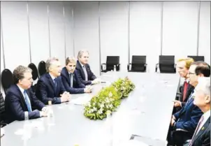  ?? PRESIDENCI­A ARGENTINA/AFP ?? Argentina’s President Mauricio Macri (third left), Economy Minister Nicolas Dujovne (second left) and Central Bank President Luis Caputo (fourth left) hold a meeting with US Secretary of the Treasury Steven Mnuchin (second right) and US Chairman of the Federal Reserve Jerome Powell (right) in Buenos Aires on Sunday.