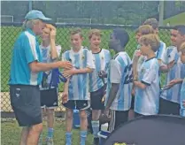  ?? PHOTO BY MARK KENNEDY ?? Pedro Kozak hands out medals to his players after a tournament in Birmingham, Alabama, last year.