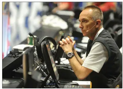  ??  ?? University of Arkansas public address announcer John George is shown during the 2016 SEC Men’s Basketball Tournament at Bridgeston­e Arena in Nashville, Tenn. George, who has seen a lot in 14 years as the public address announcer for the SEC Tournament, said he was stunned when the tournament was canceled last week. “You just sit back in your chair for a moment and think, ‘Is this really happening?’ ” George said. (NWA Democrat-Gazette file photo)