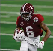  ?? AP PHOTO BY ROGER STEINMAN ?? Alabama wide receiver Devonta Smith (6) gains yardage after a catch in the first half of the Rose Bowl NCAA college football game against Notre Dame in Arlington, Texas, Friday, Jan. 1.