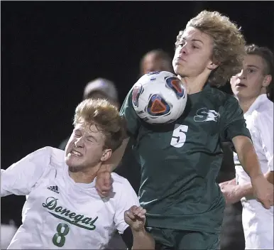  ?? PETE BANNAN — DAILY LOCAL ?? Bishop Shanahan’s (5) Zander Domsohn tops Donegal’s (8) Sira Mumoper in State playoffs Tuesday evening. The Eagles went on to a 2-0victory.