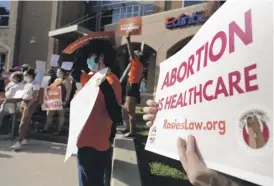  ?? JOEL MARTINEZ/THE MONITOR VIA AP ?? Abortion-rights supporters gather to protest the Texas law Wednesday in front of Edinburg City Hall in Edinburg, Texas.