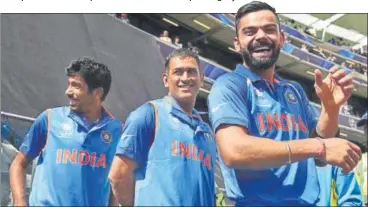  ?? GETTY IMAGES ?? ▪ India captain Virat Kohli (right) and Jasprit Bumrah (left) are in the top tier while MS Dhoni is in the second tier now.