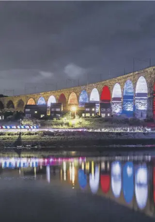  ??  ?? 0 The Royal Border Bridge, illuminate­d in red, white and blue, enables people to