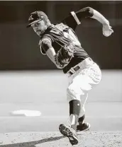  ?? Ron Vesely / Getty Images ?? Steve Cishek is a veteran reliever with an unusual arm slot who signed a minor league deal.