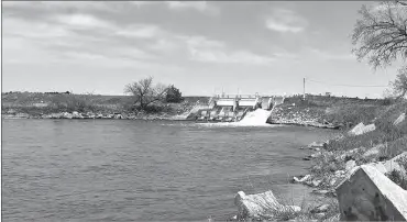  ?? Kelli Loos ?? Pictured above, the small but mighty Milburn Dam, built in the mid-1950’s and situated north and east of Merna, is used to irrigate 14,625 acres of land once considered part of the “Great American Desert.” Thanks to irrigation, it is now highly productive crop land.