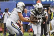  ?? ED MULHOLLAND / AP IMAGES ?? Melvin Gordon rushed for 1,105 yards and 8 touchdowns last season.