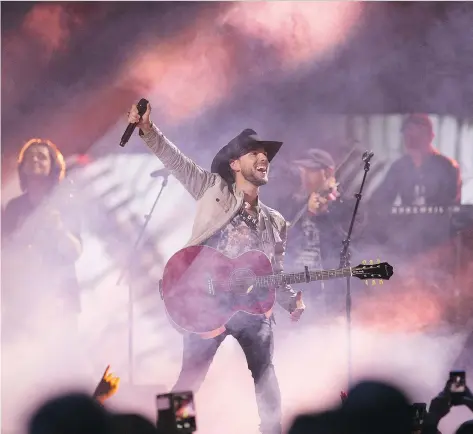  ?? KAYLE NEIS ?? Brett Kissel performs at the CCMA Awards after winning male artist of the year and video of the year for I Didn’t Fall In Love With Your Hair.