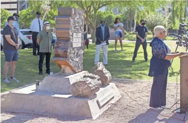  ??  ?? Signa Oliver, an Army veteran and volunteer for VetForward, takes part in a news conference Wednesday to demand the removal of the Confederat­e monument from Wesley Bolin Plaza, outside the Arizona Capitol Building.