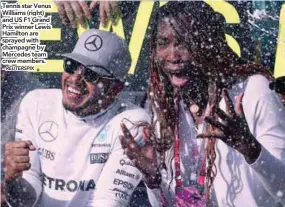  ?? – REUTERSPIX ?? Tennis star Venus Williams (right) and US F1 Grand Prix winner Lewis Hamilton are sprayed with champagne by Mercedes team crew members.