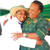  ?? ?? Environmen­tal patron First Lady Dr Auxillia Mnangagwa hugs environmen­tal enthusiast Catherine Chitengu during the launch of a model children’s green park in Glen Norah, Harare yesterday