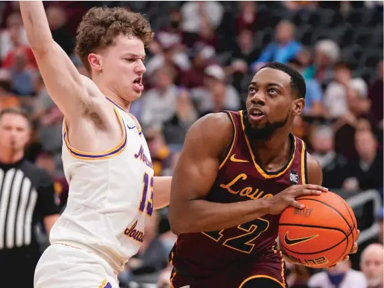  ?? AP ?? Marquise Kennedy (13 points and six rebounds) heads to the basket against Northern Iowa’s Bowen Born. Loyola will play Drake in the Missouri Valley Conference final Sunday.