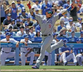  ?? Associated Press ?? Celebratin­g: Chicago Cubs' Javier Baez celebrates after scoring on a three-run double by Anthony Rizzo during the seventh inning of a baseball game against the Los Angeles Dodgers in Los Angeles Thursday.