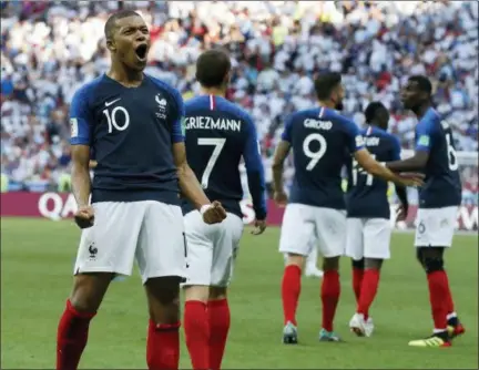  ?? DAVID VINCENT — THE ASSOCIATED PRESS FILE ?? Teen sensation Kylian Mbappe celebrates after scoring during France’s World Cup round of 16 victory over Argentina.