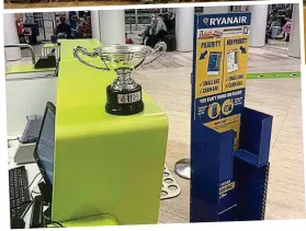  ?? ?? Not allowed on flight: The trophy on the Ryanair check-in desk