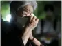  ?? KYODO NEWS VIA AP ?? A visitor prays in front of the cenotaph dedicated to the victims of the atomic bombing Aug. 6 at the Hiroshima Peace Memorial Park in Hiroshima, Japan.