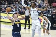  ?? STEPHEN SPILLMAN — THE ASSOCIATED PRESS ?? Spurs center Victor Wembanyama, right, defends against Nuggets center Nikola Jokic, left, during the first half of on Friday in Austin, Texas.