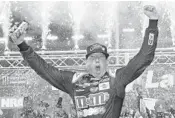  ?? BRIAN LAWDERMILK/ ?? Kyle Busch celebrates in victory lane after winning the Monster Energy NASCAR Cup Series Bass Pro Shops NRA Night Race at Bristol Motor Speedway. Busch swept all three races at Bristol this past week.