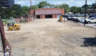  ?? Ernest A. Brown photo ?? In addition to the new security fencing and gating being installed at Woonsocket Police headquarte­rs, the facility is also getting a brand new parking lot with expanded spacing for police vehicles.