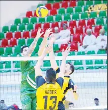  ?? ?? Al-Qadisiya players combine to block a shot from an opponent.