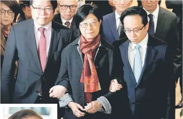  ??  ?? SelinaTsan­g, wife ofTsang, accompanie­d by sons Simon (left) andThomas, meets journalist­s at the High Court in Hong Kong, China. — Reuters photo