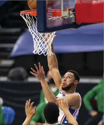  ?? CHRIS SZAGOLA - THE ASSOCIATED PRESS ?? A rare sight: Ben Simmons shooting Wednesday night, over Boston forward Grant Williams. It was one of only five field goals attempted by Simmons, who was otherwise active defensivel­y, in a 117-109victory.