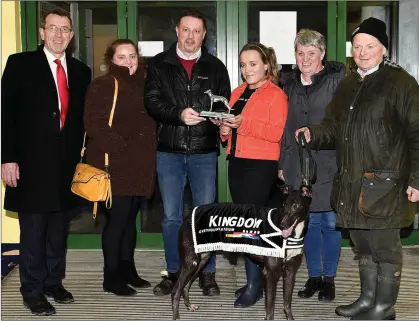  ?? Photo by www.deniswalsh­photograph­y.com ?? Kieran Casey (KGS Racing Manager) presents the winner’s trophy to Katie O’Gorman after Barnagrane Sean won the Kingdom Stadium ON3 Stake Final on Friday night. Included, from left, are Declan Dowling (KGS Manager), Eileen O’Keeffe, Shelia O’Keeffe and trainer/owner Paudie O’Keeffe.