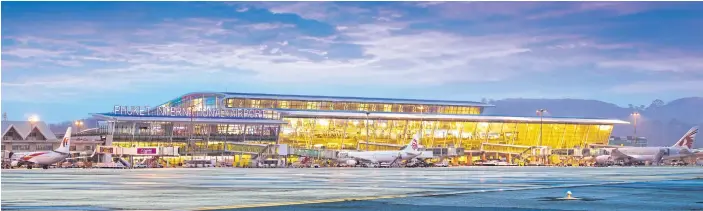  ??  ?? TAKING OFF: The opening of the new terminal at Phuket Internatio­nal Airport last September increased annual handling capacity from 6.5 million to 12.5 million passengers.