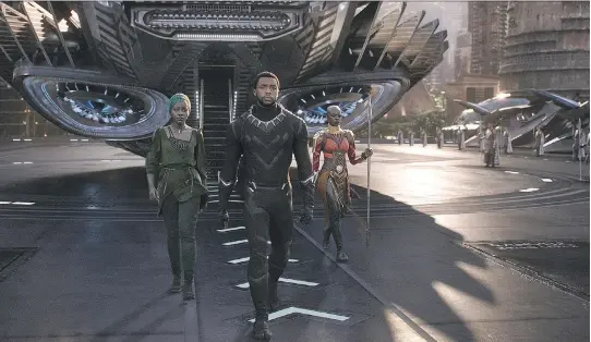  ?? DISNEY ?? Chadwick Boseman, centre, saw his star power soar when he took on the role of Black Panther, seen with Nakia (Lupita Nyong’o), left, and Gen. Okoye (Danai Gurira).