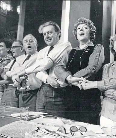  ??  ?? Harold Wilson and Barbara Castle, right, lead the chorus of Auld Lang Sang at Labour