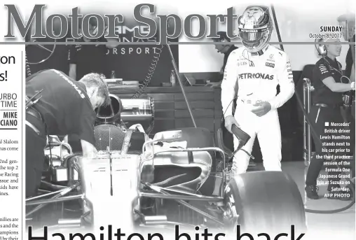  ?? AFP PHOTO ?? Mercedes’ British driver Lewis Hamilton stands next to his car prior to the third practice session of the Formula One Japanese Grand Prix at Suzuka on Saturday.