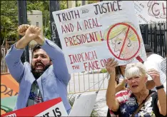  ?? ALAN DIAZ / AP ?? Protesters opposed to President Donald Trump chant during his visit Friday in Miami. Trump’s order forbids commerce with hotels and other businesses linked to the Cuban military’s economic arm.