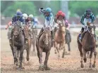  ?? MATT STONE/COURIER JOURNAL ?? Jockey Javier Castellano raises his fist in celebratio­n after he and Mage won the 149th Kentucky Derby.