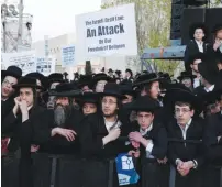  ?? (Baz Ratner/Reuters) ?? HAREDIM PROTEST in Jerusalem on Tuesday against men from their sector serving in the IDF.