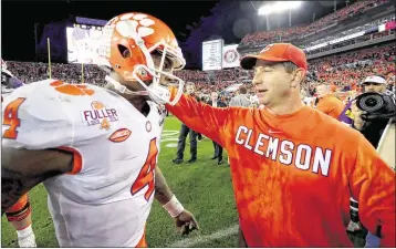  ?? TOM PENNINGTON / GETTY IMAGES ?? Clemson QB Deshaun Watson and coach Dabo Swinney, shown celebratin­g after defeating Alabama, say the Tigers will use the victory as a springboar­d to more. “Just wait the next five years,” Watson said.