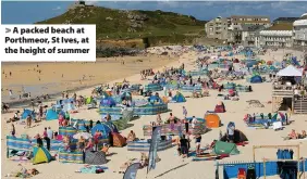  ??  ?? > A packed beach at Porthmeor, St Ives, at the height of summer