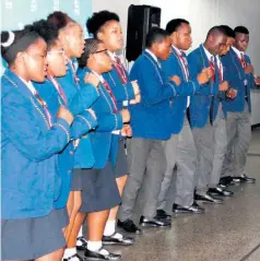  ?? ?? Members of the Empangeni High School choir entertaine­d guests with their energetic performanc­e