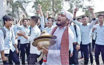  ??  ?? Students shout slogans during a protest to demand the withdrawal of the Citizenshi­p Amendment Bill in Nagaon district in Assam on Wednesday. — Reuters