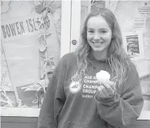  ?? FAMILY PHOTO ?? Emily Epp, 17, holds a shell she found on her swim around Bowen Island on Saturday.