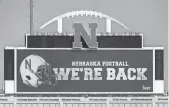  ?? AP ?? A video board at the University of Nebraska on Sept. 16 projects the news of the return of Big Ten NCAA college football. (AP)