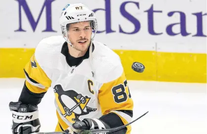  ?? GEOFF BURKE • USA TODAY SPORTS ?? Pittsburgh Penguins centre Sidney Crosby juggles a puck during warm-ups prior to a May 1 game against the Washington Capitals at Capital One Arena.